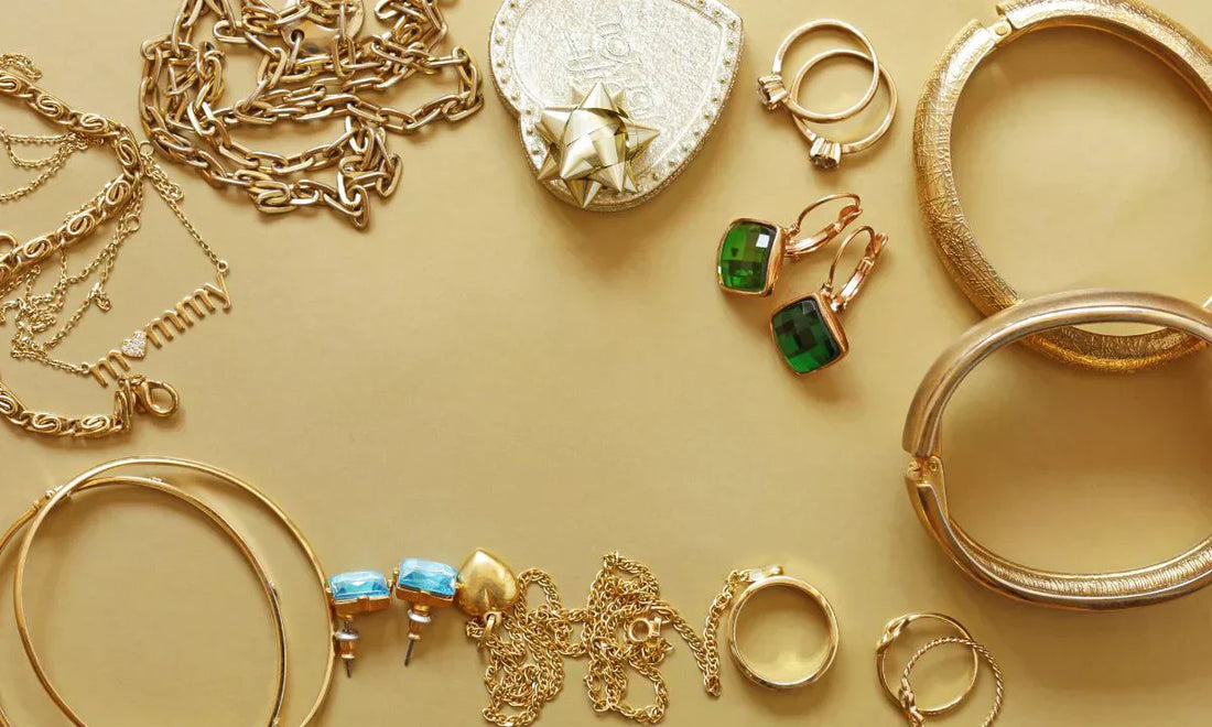 capsule jewelry with neatly arranged timeless pieces including rings, earrings, and chains.