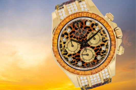 Luxury Rolex Daytona Leopard watch with diamond-studded bezel and bracelet, featuring a bold leopard-print dial, displayed against a golden sunset background.