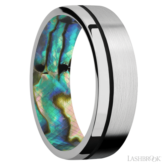 7 mm wide/Flat/14K White Gold band with one 0.5 mm Off Center inlay of Black also featuring a Abalone sleeve.
