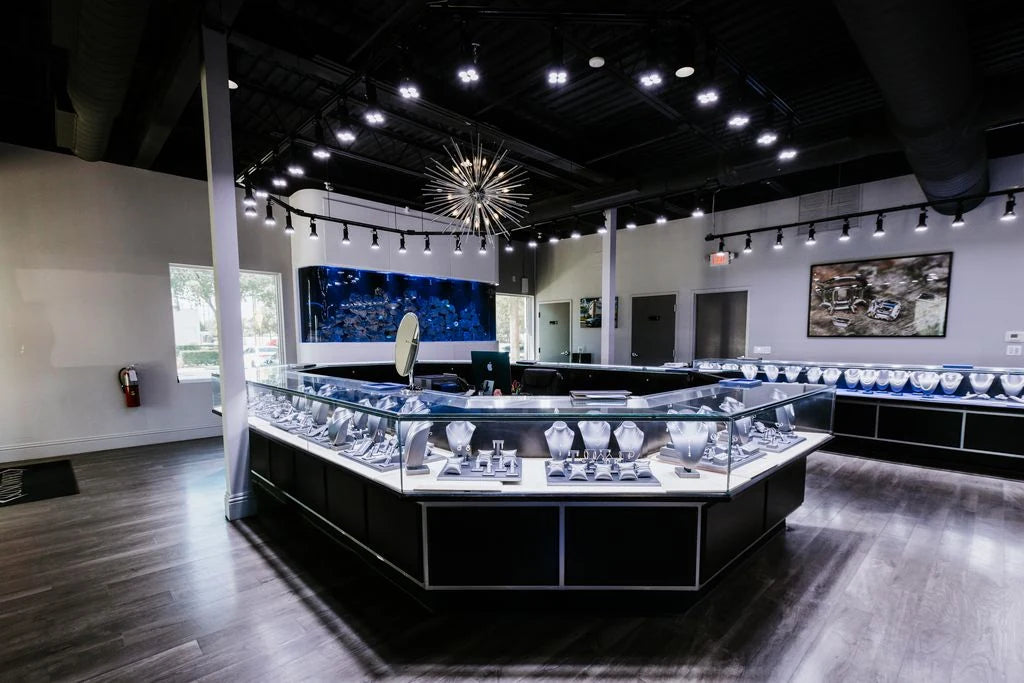 Jewelry cases and a large aquarium inside Diamonds By Raymond Lee
