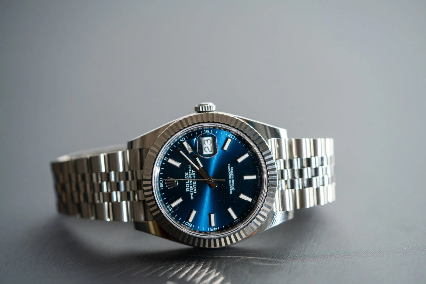 Blue dial wristwatch with a metal bracelet