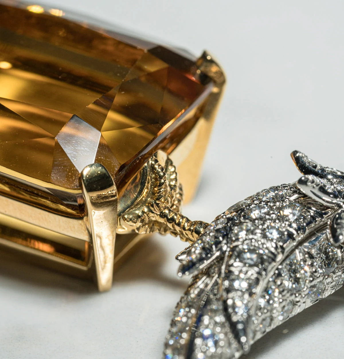Close view of jewelry with an amber colored faceted stone