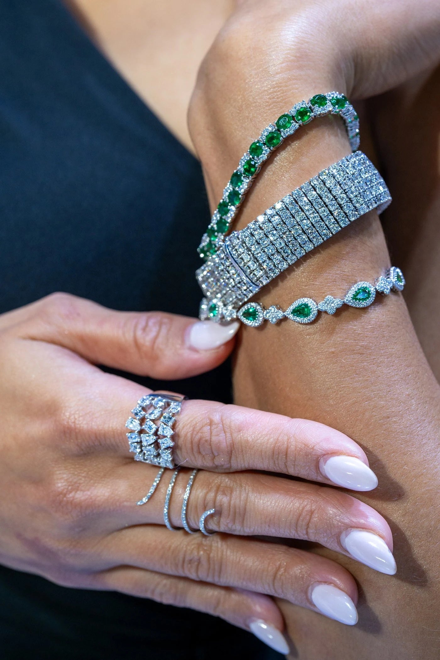 Green gemstone rings and bracelets styled together