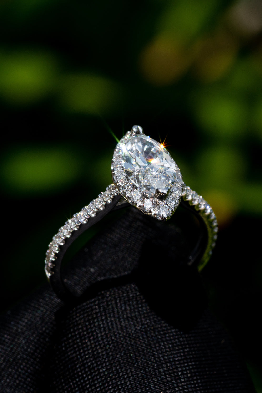 Oval Cut Diamond Center Stone in a White Gold Halo Setting