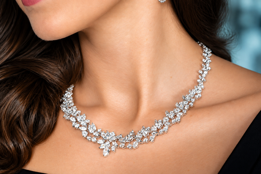 Woman wearing a necklace with a floral pattern and matching earring