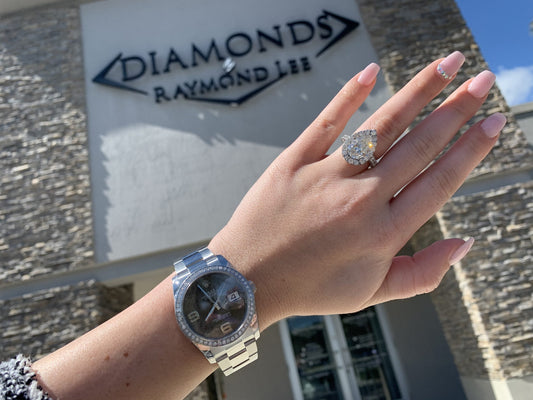 Dark dial Datejust and diamond ring photographed at the showroom.