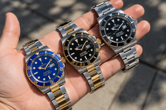Three Rolex Submariner watches with blue and black dials.