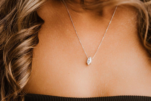 A marquise shaped pendant on a fine chain.