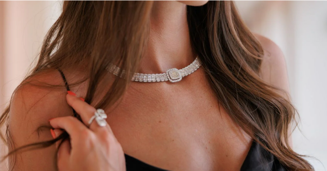 Diamond choker necklace, emerald-cut centerpiece, luxury jewelry, diamond ring, elegant evening wear.