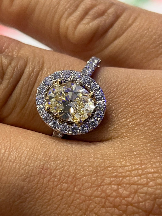 Oval-Cut Yellow Diamond Ring with Halo