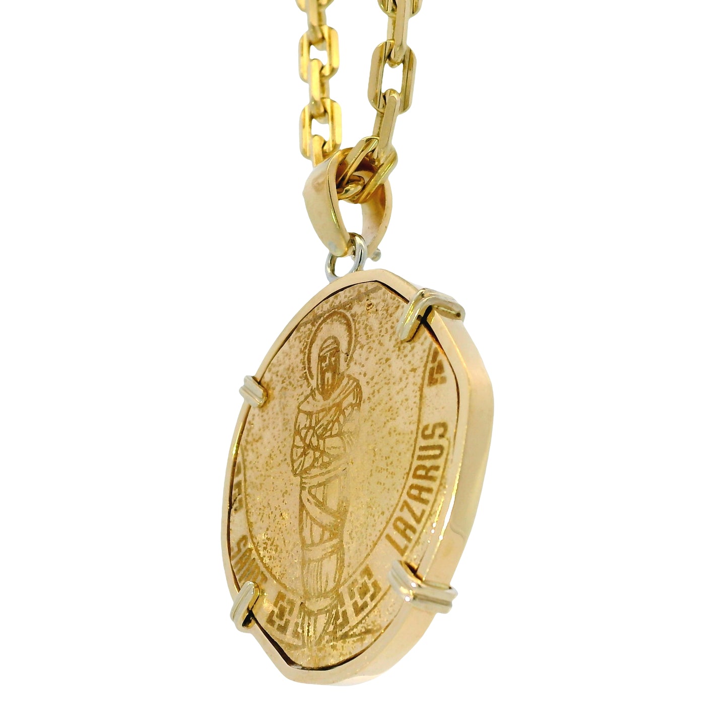 Gold pendant necklace with a religious figure on a white background