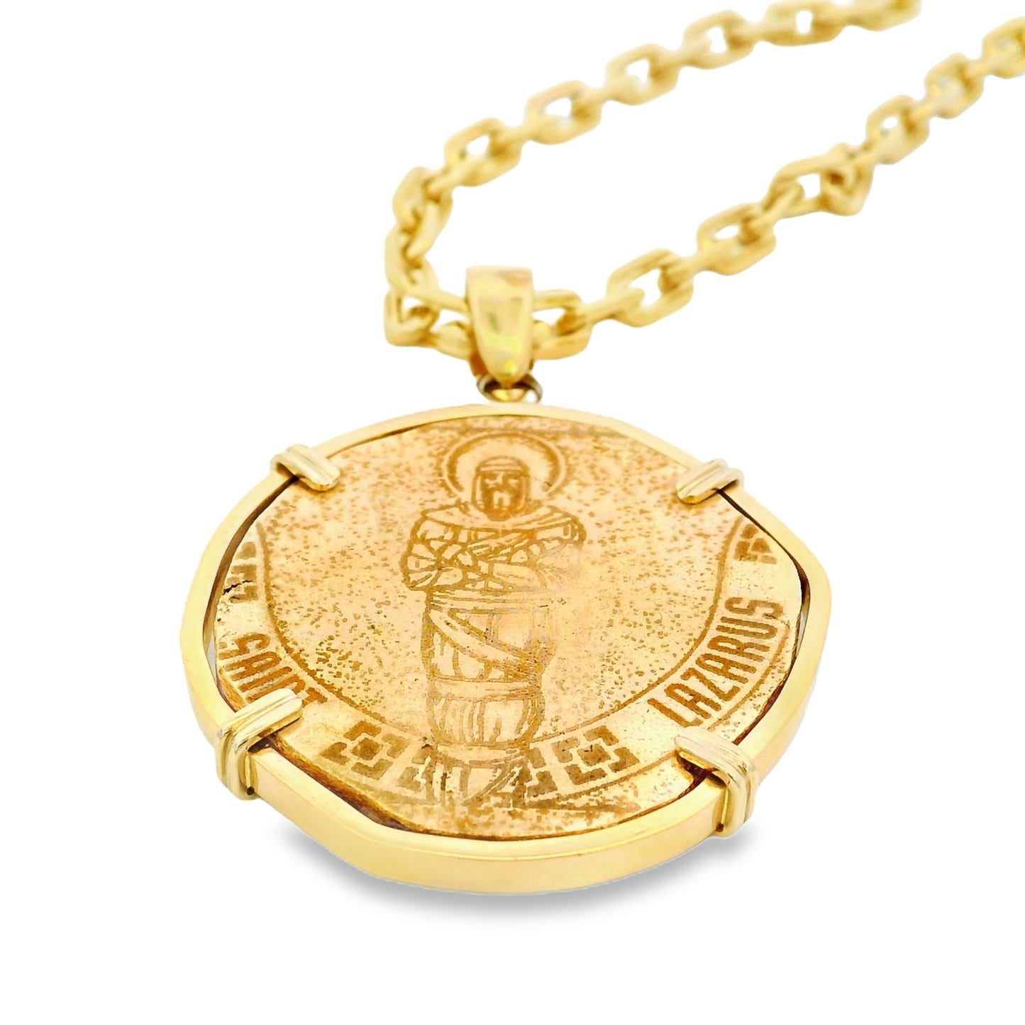 Gold zodiac pendant necklace on a white background