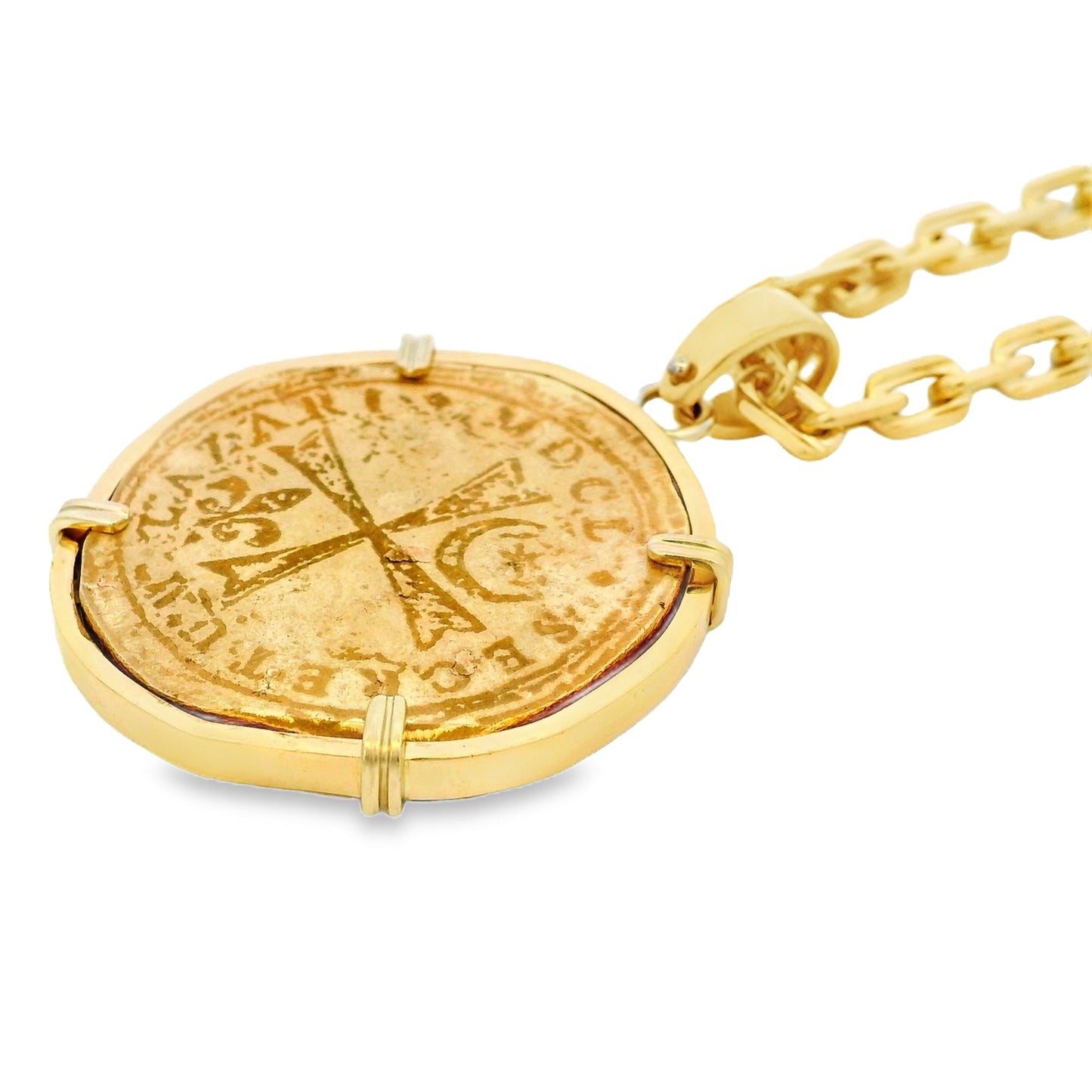 Gold necklace with a coin pendant on a white background