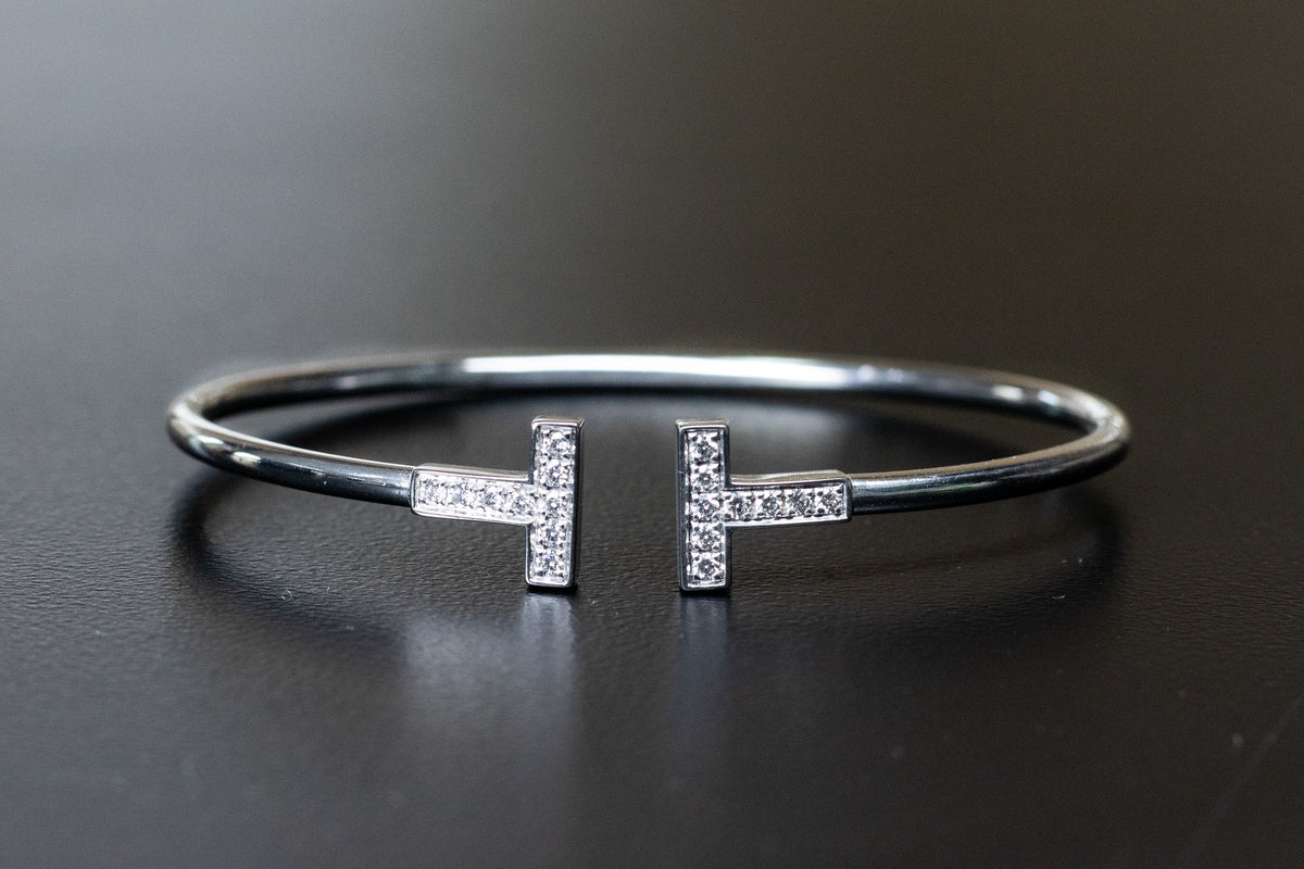 Tiffany T bracelet with stone-set ends on a dark surface