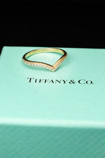 Tiffany ring resting on a blue presentation box