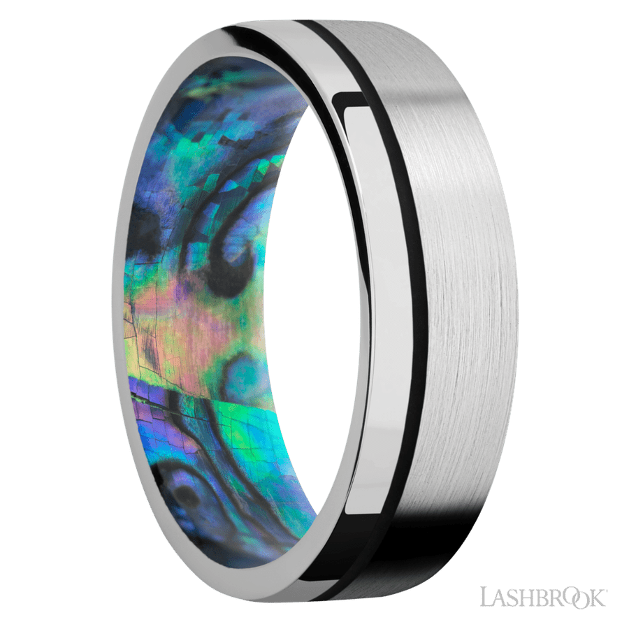 7 mm wide/Flat/14K White Gold band with one 0.5 mm Off Center inlay of Black also featuring a Abalone sleeve.