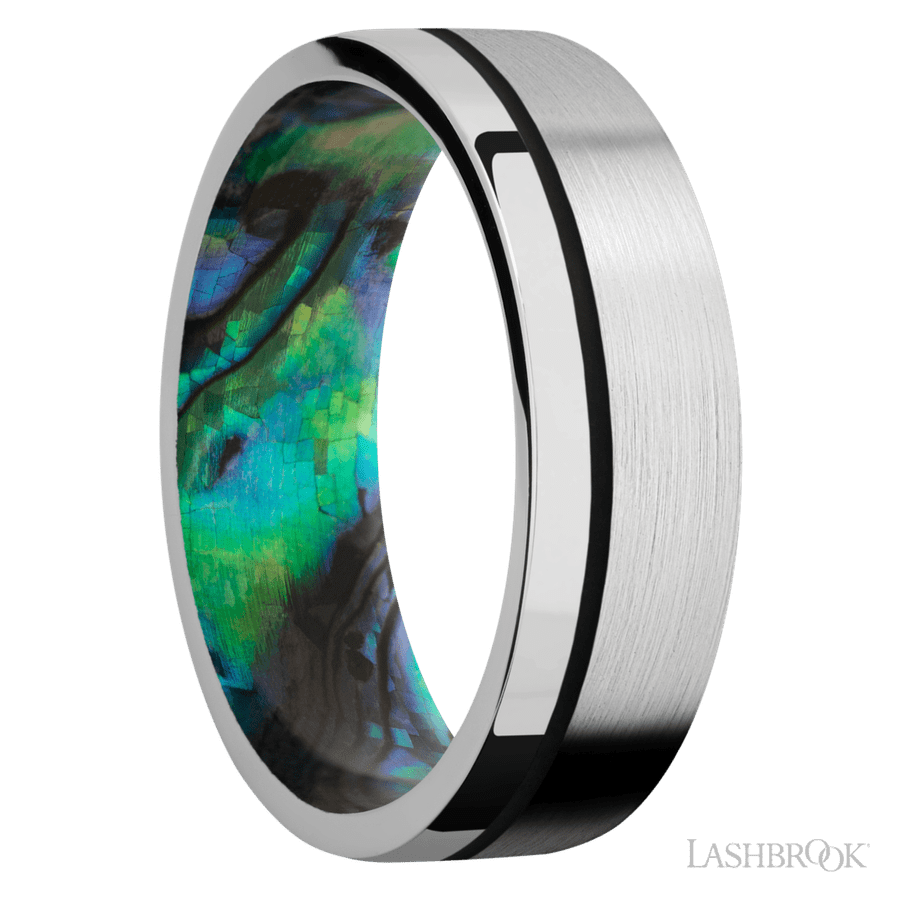 7 mm wide/Flat/14K White Gold band with one 0.5 mm Off Center inlay of Black also featuring a Abalone sleeve.
