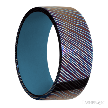 9 mm wide Flat Titanium Damascus band featuring a Royal Blue sleeve.