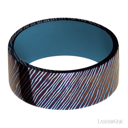 9 mm wide Flat Titanium Damascus band featuring a Royal Blue sleeve.