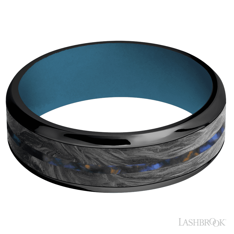 7 mm wide/Beveled/Zirconium band featuring inlays of Forged Carbon Fiber and Blue Tiger Eye also featuring a Royal Blue sleeve.