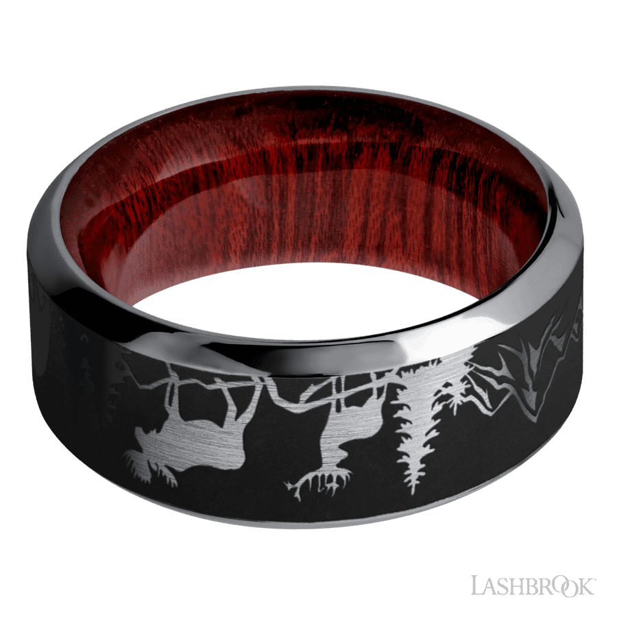 9 mm wide/High Bevel/Tantalum band with a laser carved Bear Moose Deer Mountain pattern also featuring a Blood Wood sleeve.