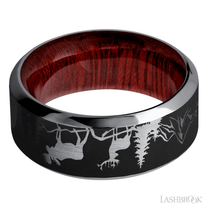 9 mm wide/High Bevel/Tantalum band with a laser carved Bear Moose Deer Mountain pattern also featuring a Blood Wood sleeve.
