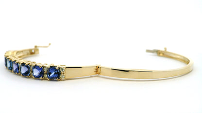 14k Yellow Gold 7.10ctw Tanzanite and 0.65ctw Round Diamond Bangle
