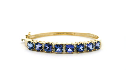 14k Yellow Gold 7.10ctw Tanzanite and 0.65ctw Round Diamond Bangle