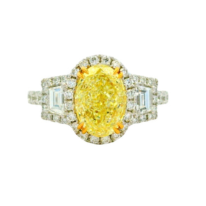 18k White and Yellow GIA 2.06ctw Oval Cut Fancy Yellow Diamond and 1.15ctw Diamond Ring