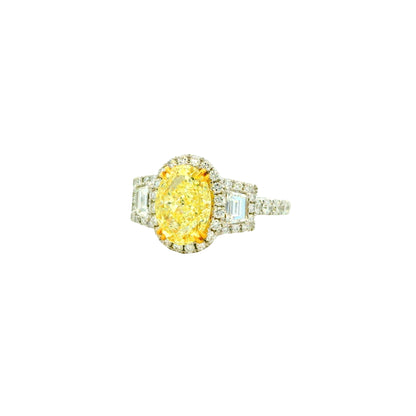 18k White and Yellow GIA 2.06ctw Oval Cut Fancy Yellow Diamond and 1.15ctw Diamond Ring