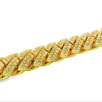 Gold bracelet with diamond-like stones on a white background