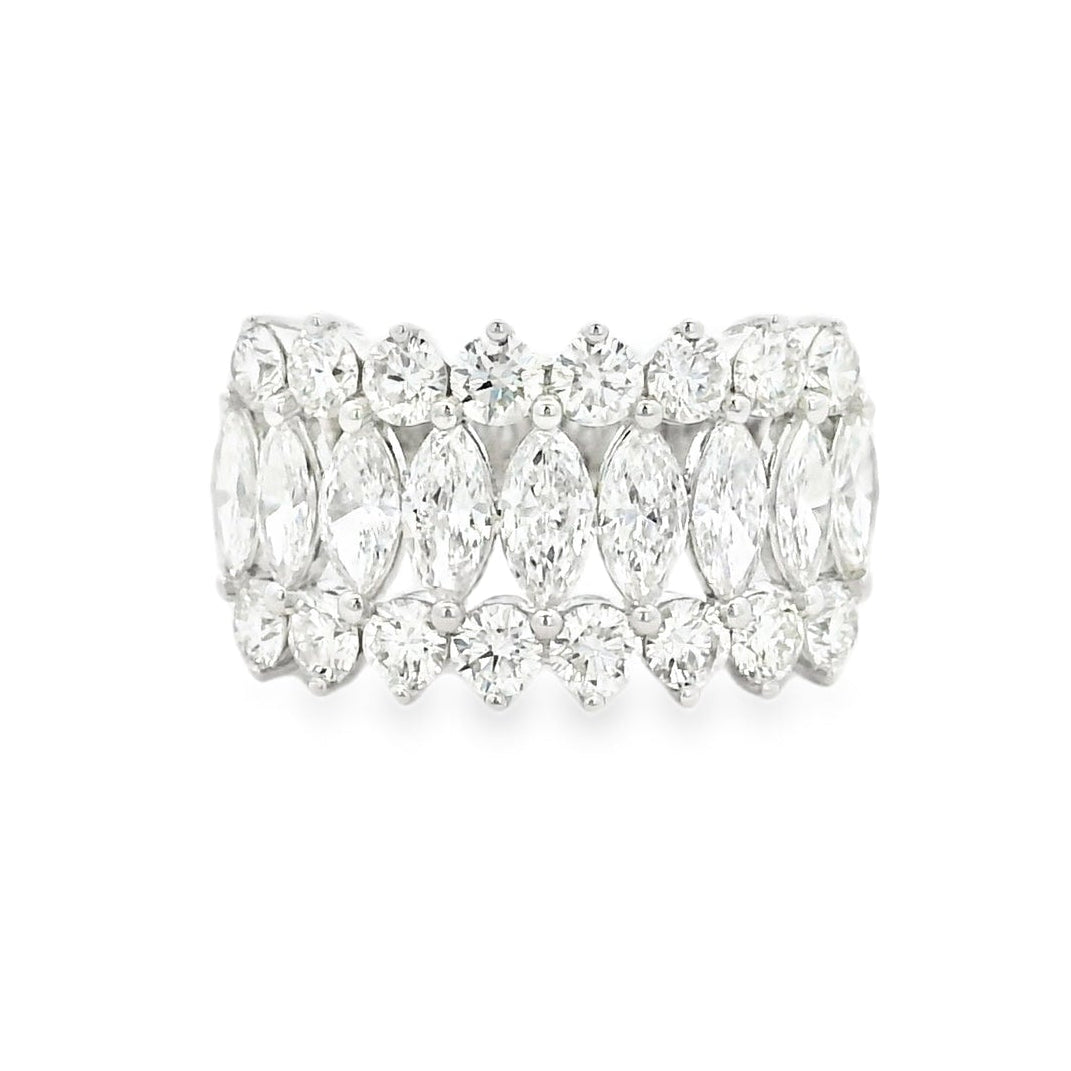 Diamond ring with marquise-shaped stones on a white background