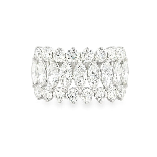 Diamond ring with marquise-shaped stones on a white background
