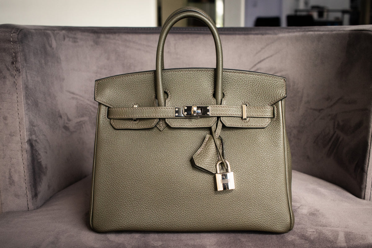 Gray-green Hermès handbag with handles and a padlock