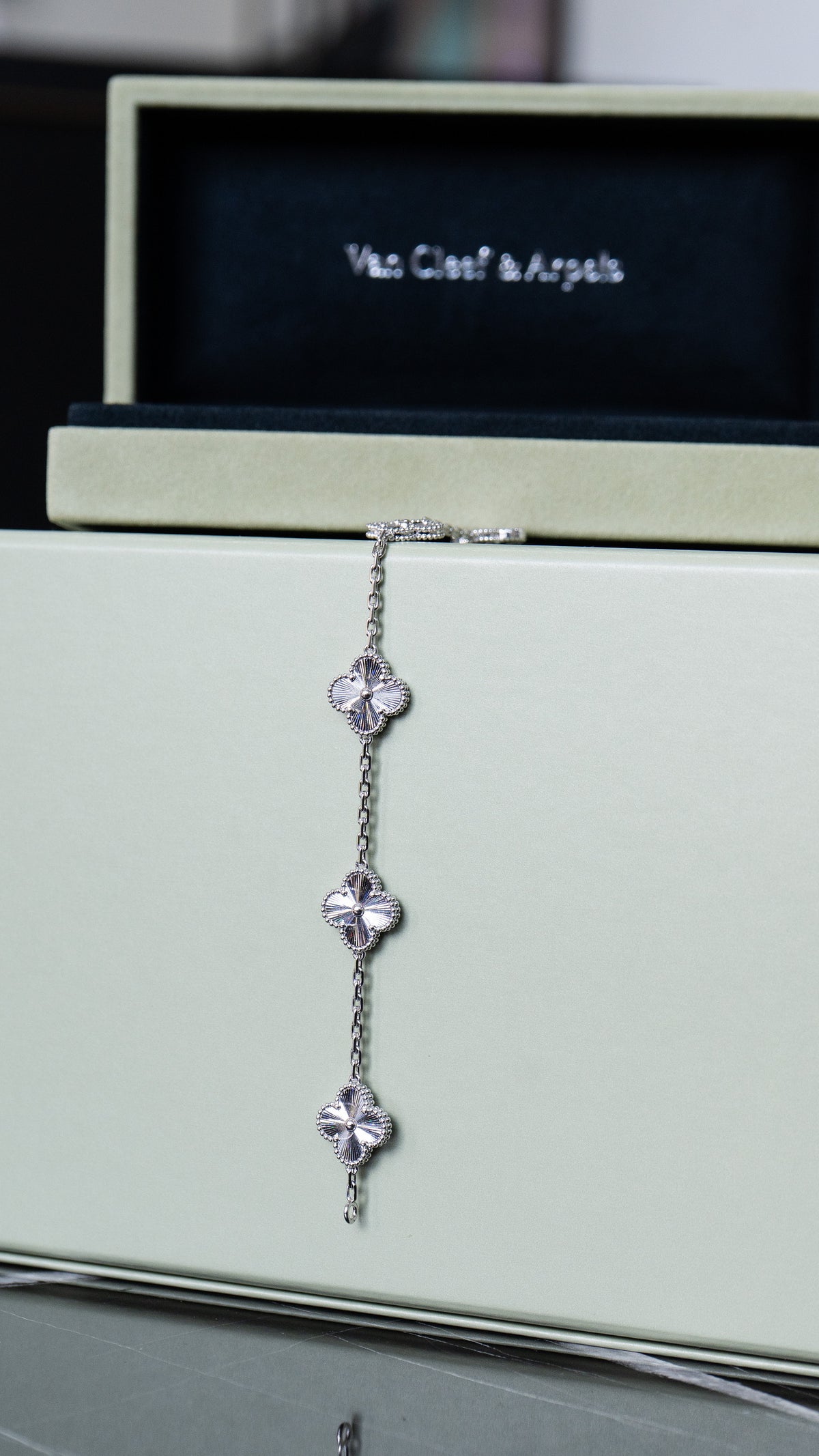 Van Cleef & Arpels motif necklace displayed vertically