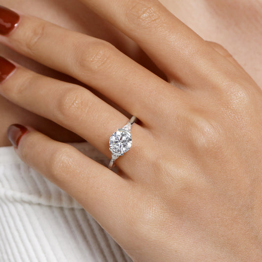 14K White Gold Half Bezel Round Three Stone Diamond Engagement Ring — Gabriel & Co. ER16685R8W44JJ; center stone shown for illustration, not included