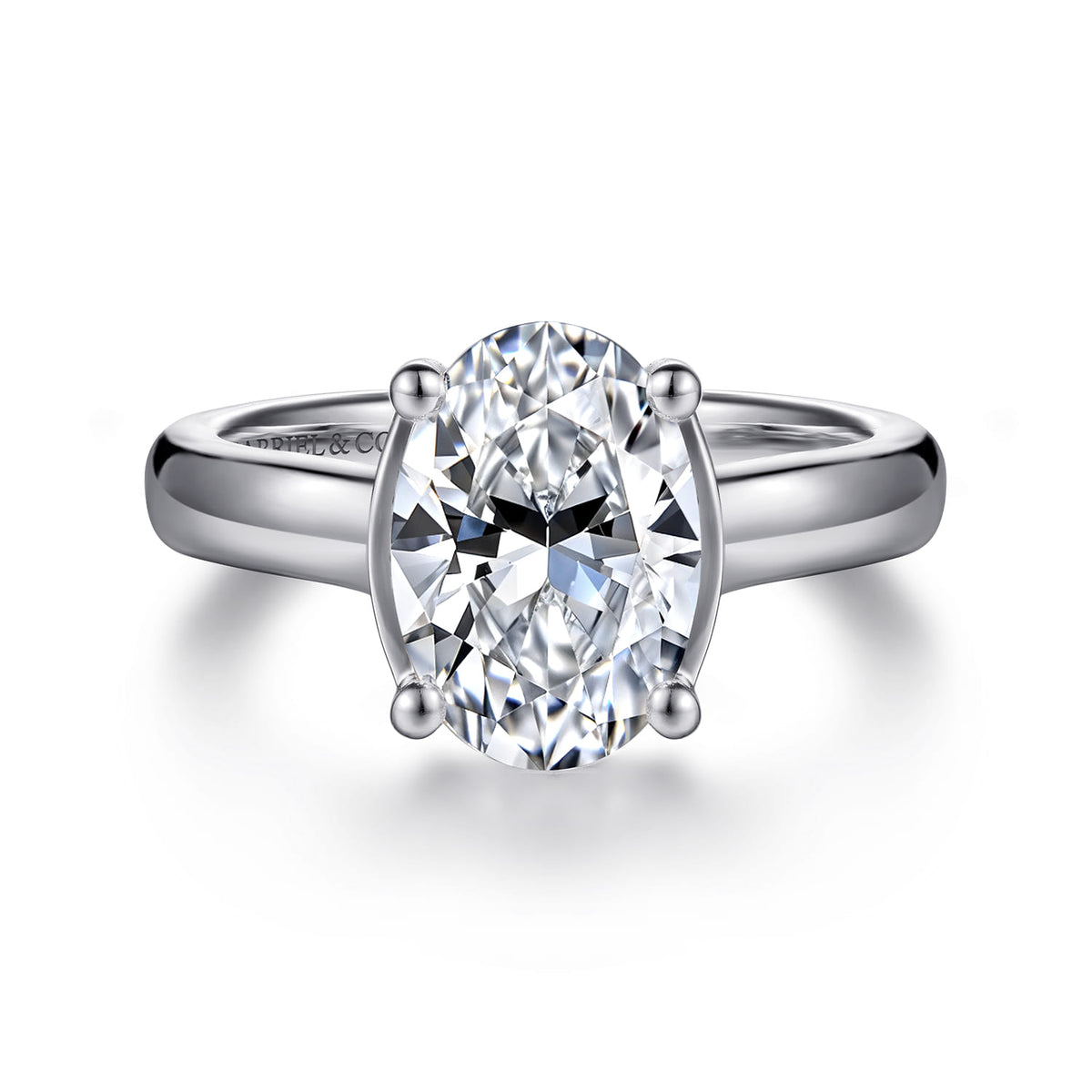 14K White Gold Half Bezel Oval Diamond Engagement Ring — Gabriel & Co. ER16707O8W44JJ; center stone shown for illustration, not included