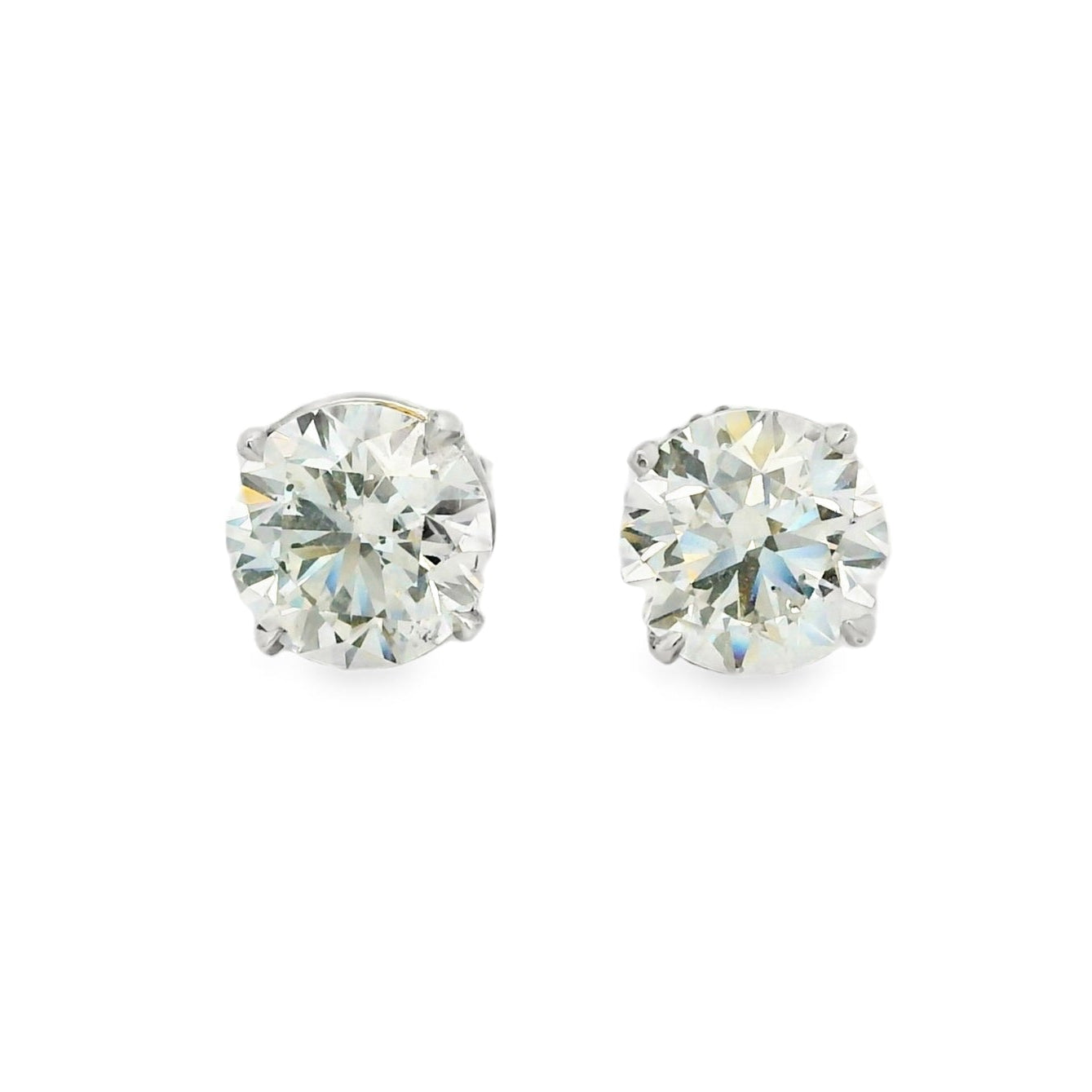 Pair of diamond stud earrings on a white background