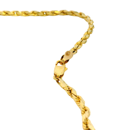 Gold chain bracelet on a white background