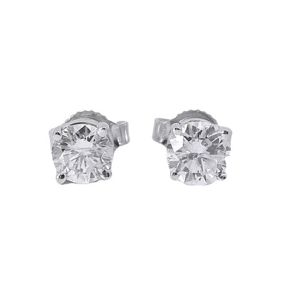 Pair of diamond stud earrings on a white background