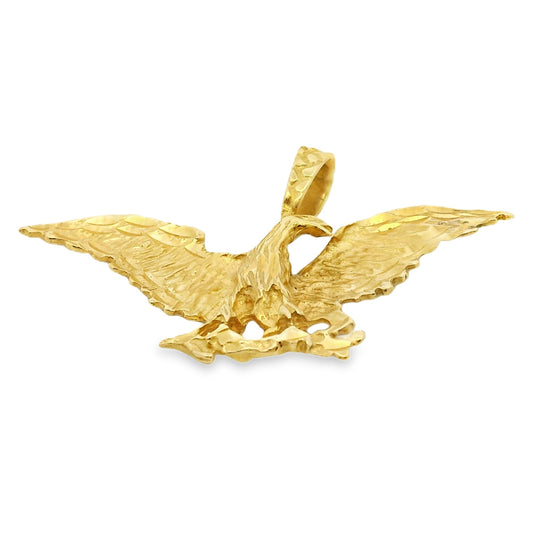 Gold eagle pendant on a white background