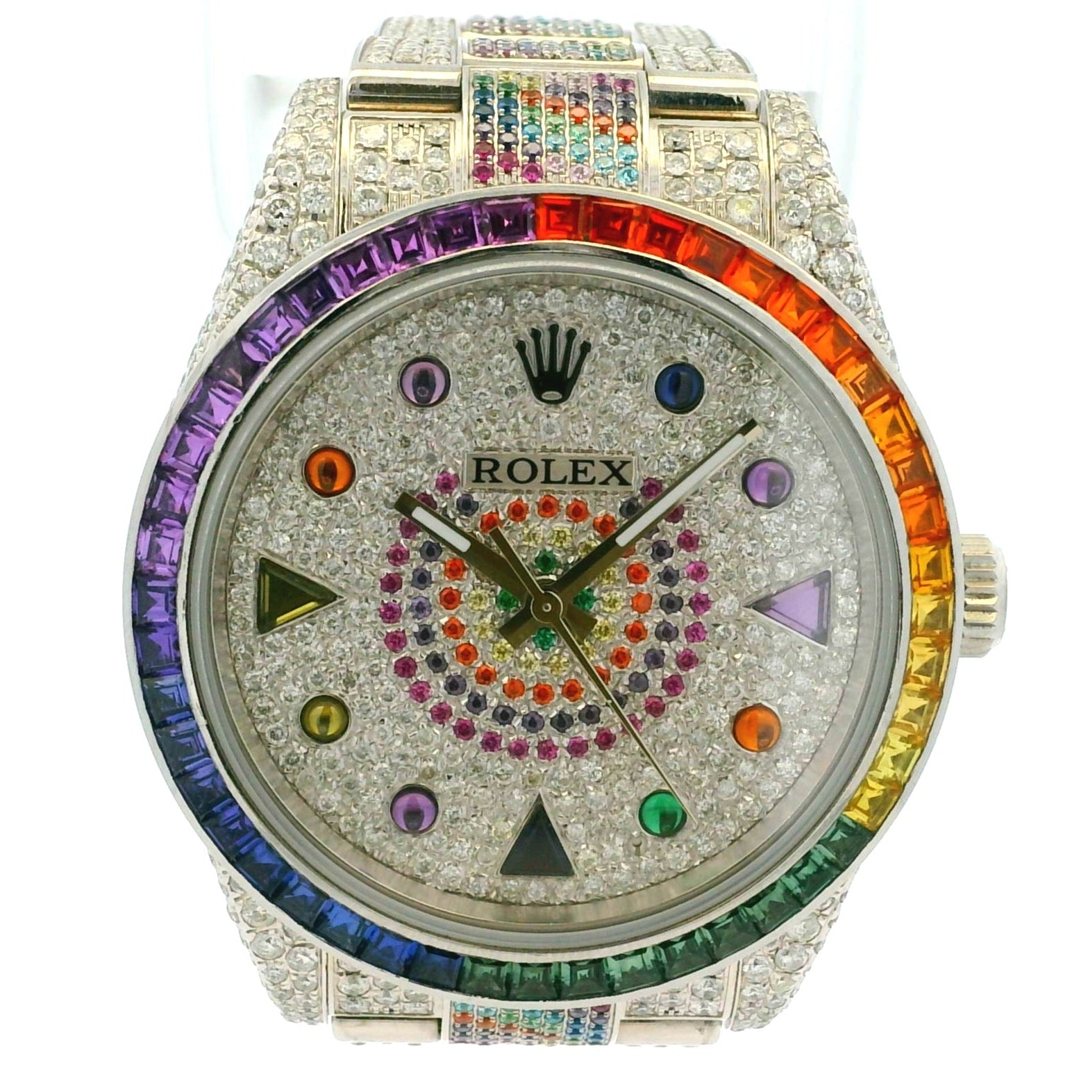 Luxury watch with a colorful rainbow bezel and gemstones on a white background