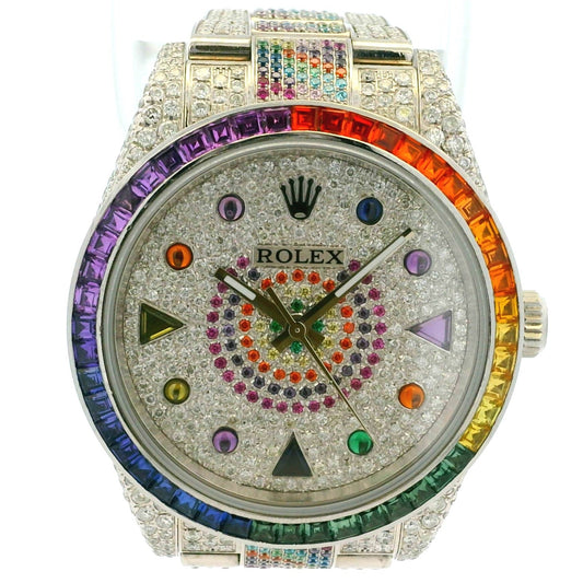 Luxury watch with a colorful rainbow bezel and gemstones on a white background