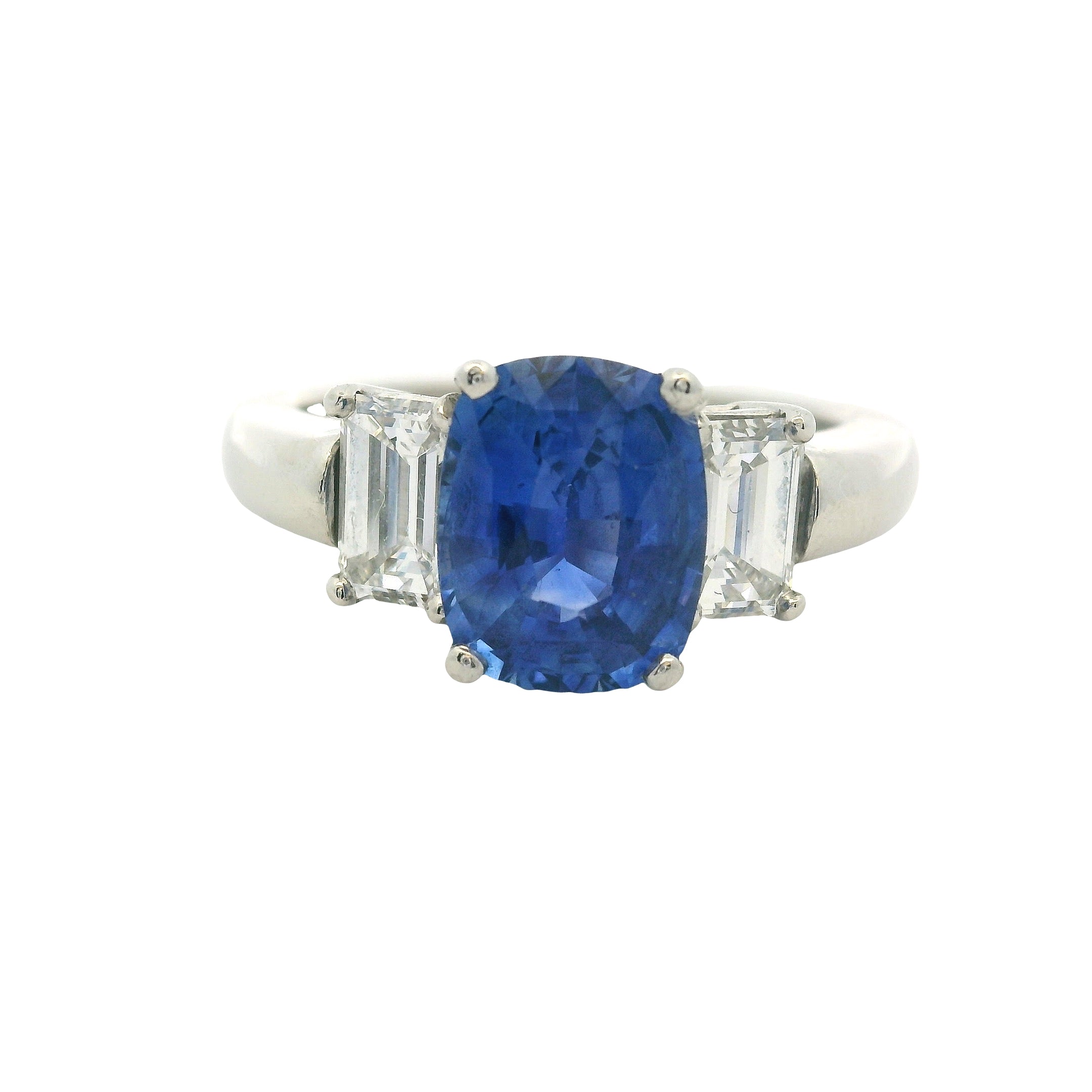 Platinum 3 Stone Ring set with Natural Cushion Blue Sapphire and Emerald Cut Diamond Side Stones