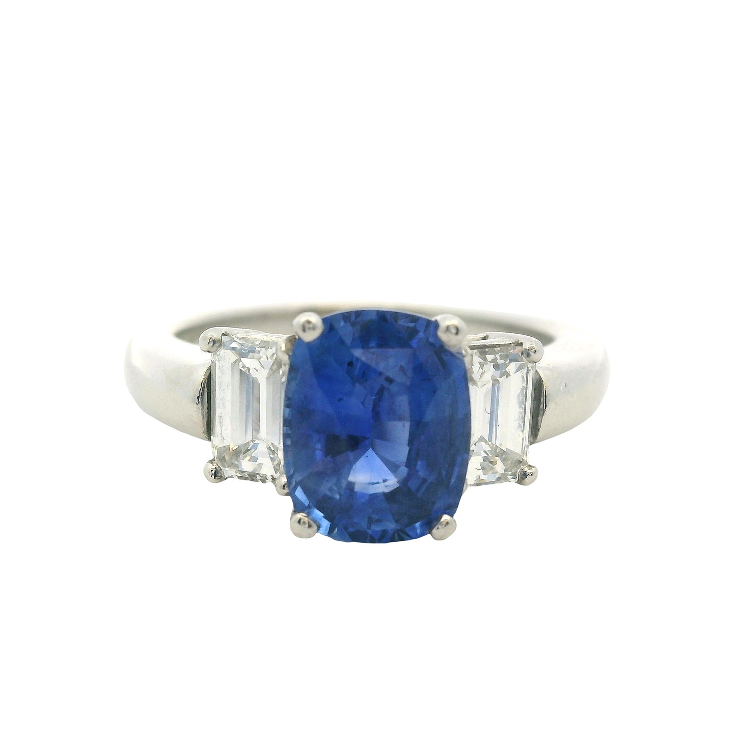Platinum 3 Stone Ring set with Natural Cushion Blue Sapphire and Emerald Cut Diamond Side Stones