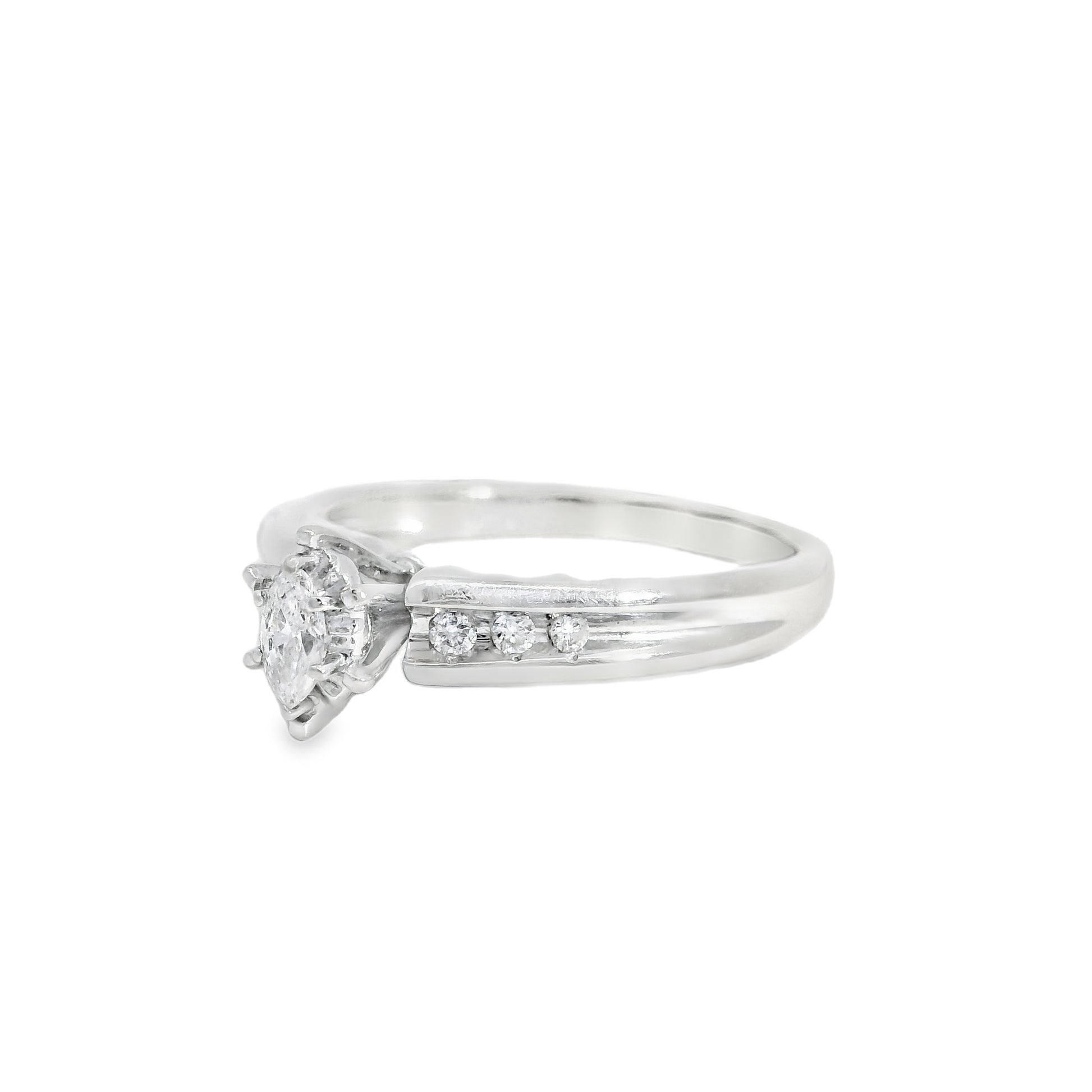 White gold engagement ring with a diamond on a white background
