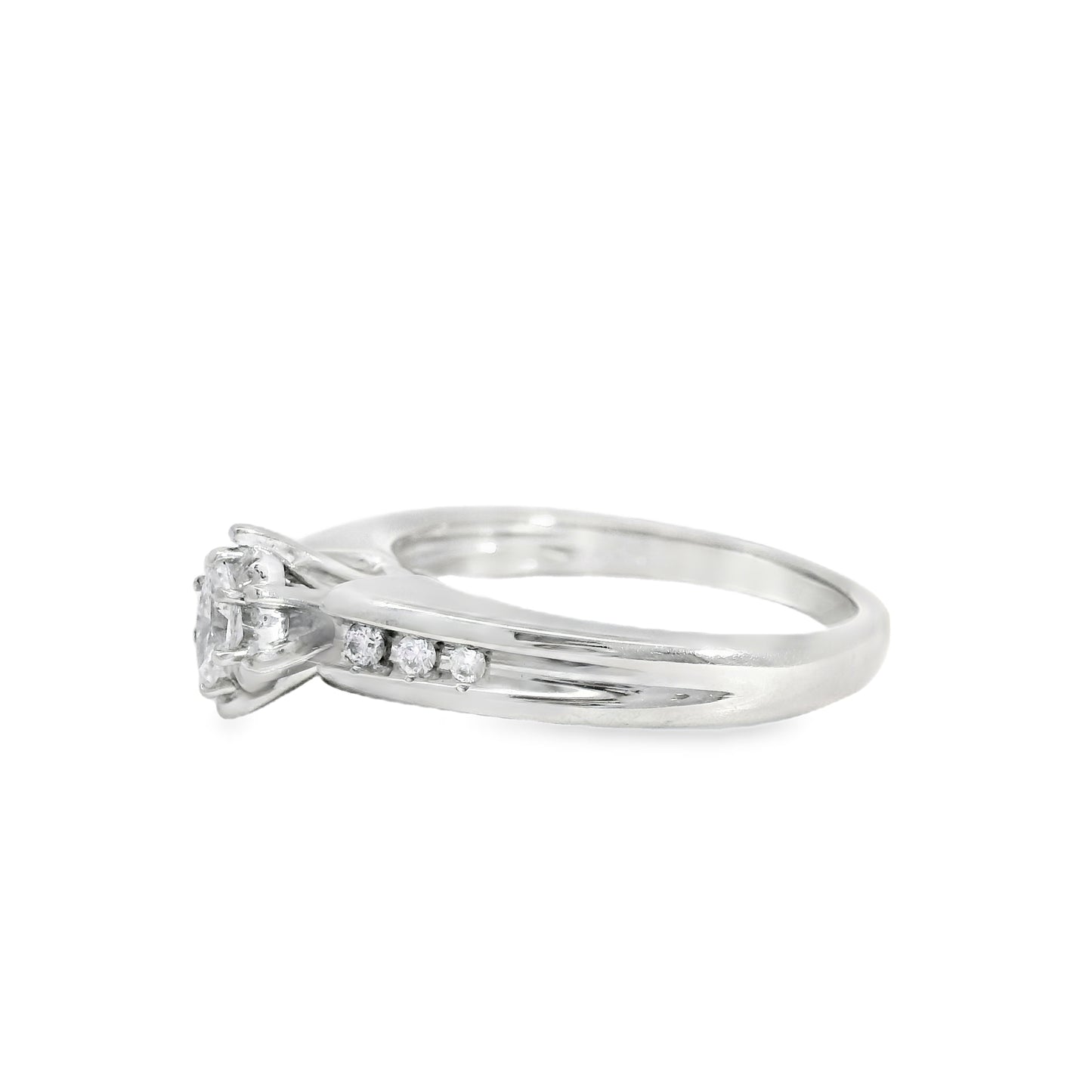 White gold engagement ring with small diamonds on a white background