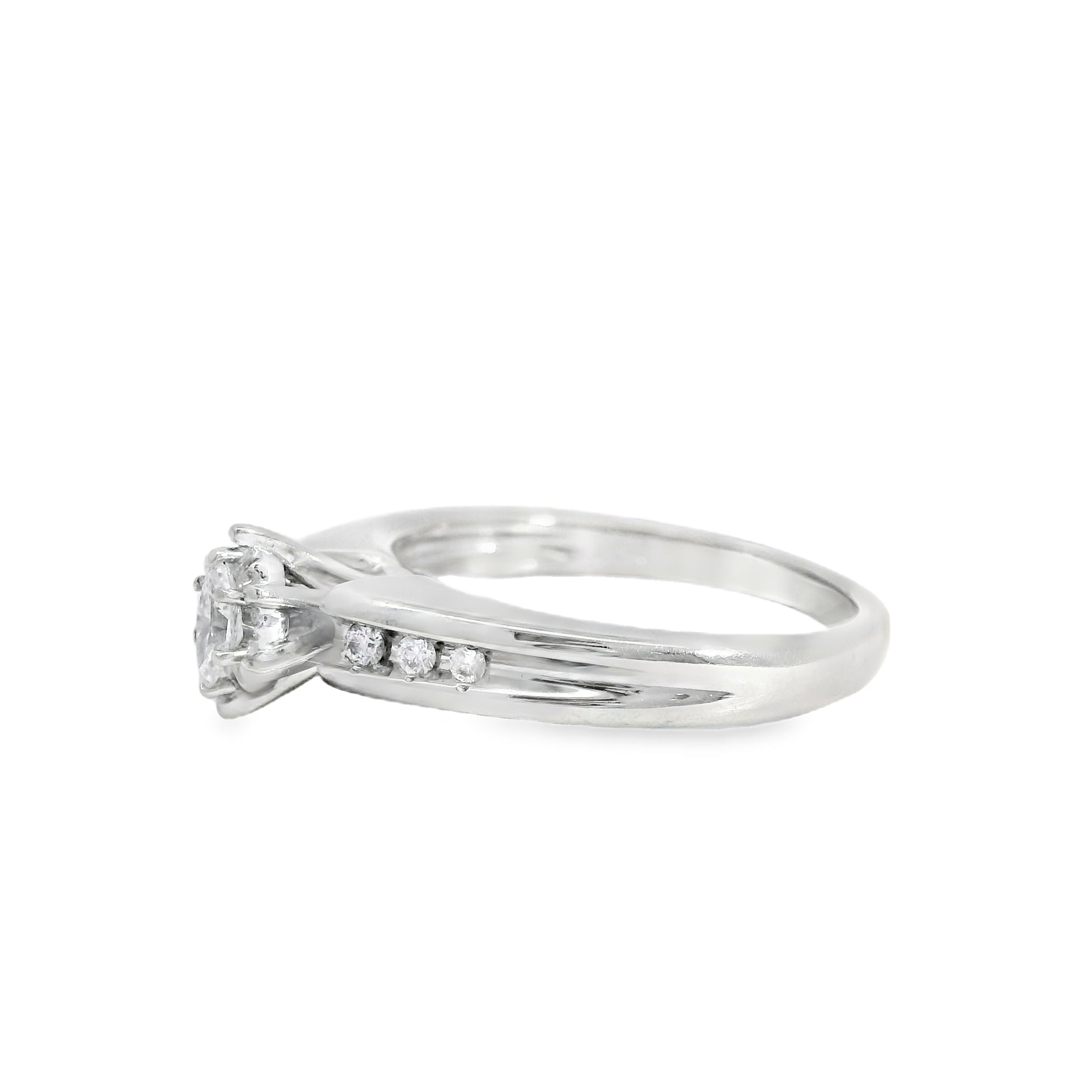 White gold engagement ring with small diamonds on a white background