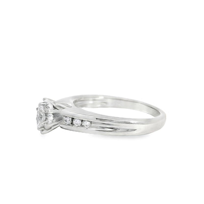 White gold engagement ring with small diamonds on a white background
