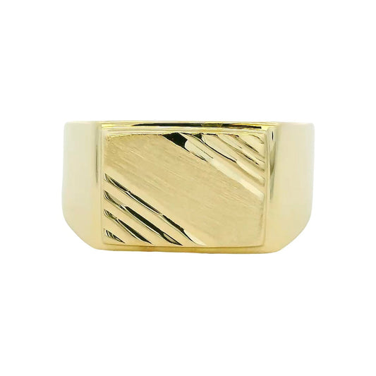 Gold ring with a textured design on a white background